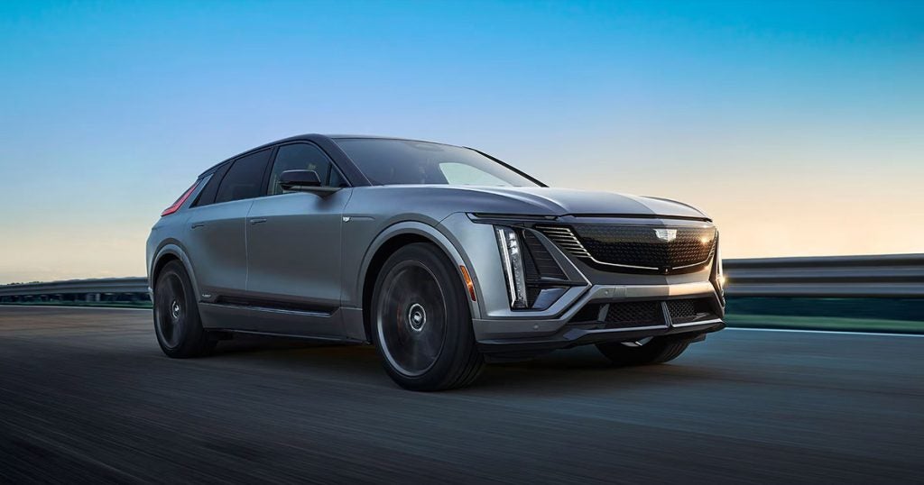 2026 Cadillac LYRIQ driving on an empty highway.