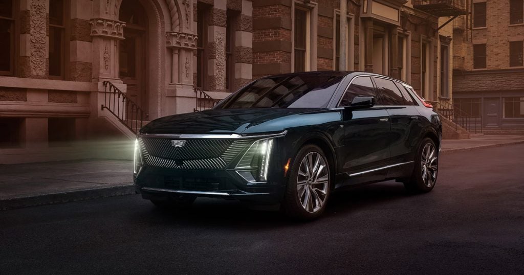 2024 Cadillac LYRIQ at dusk sitting outside of a building.