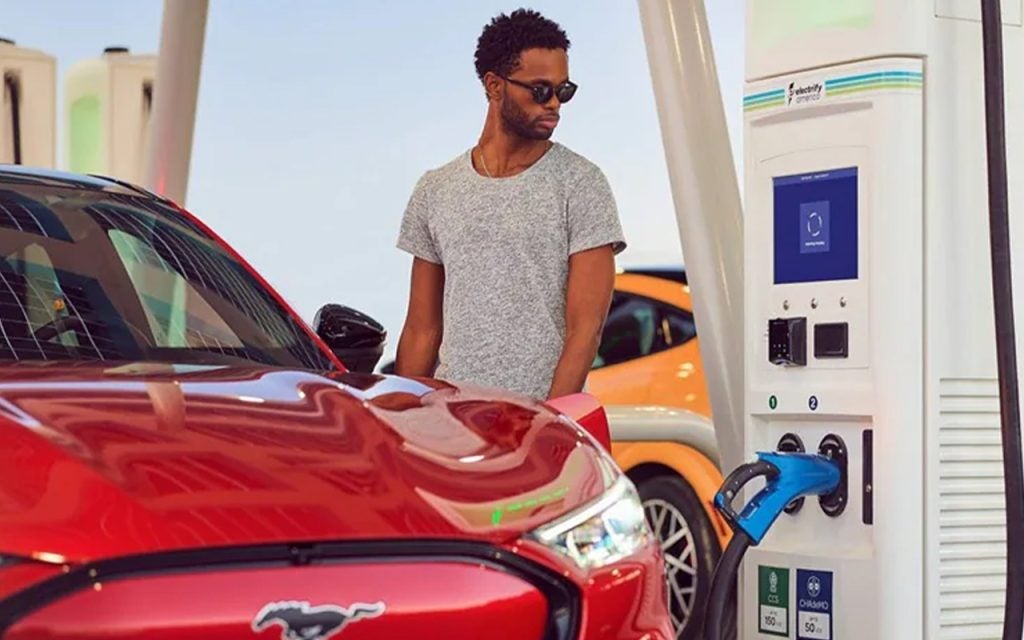 Man charging up his Ford electric vehicle.