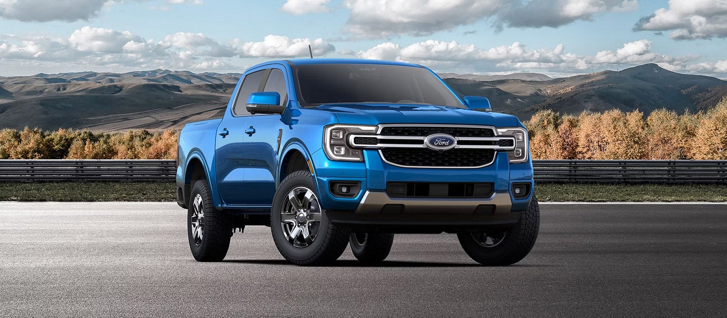 2025 Ford Ranger XL pickup truck in blue parked on scenic road with mountains in the background, available now at South Bay Ford near Los Angeles, CA.
