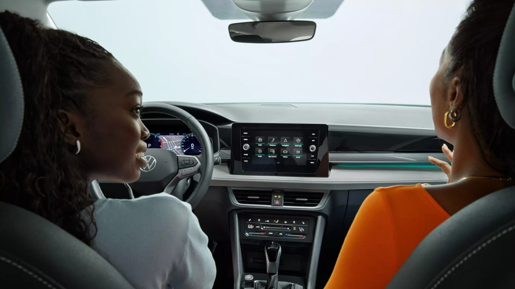 two girls driving Volkswagen Taos