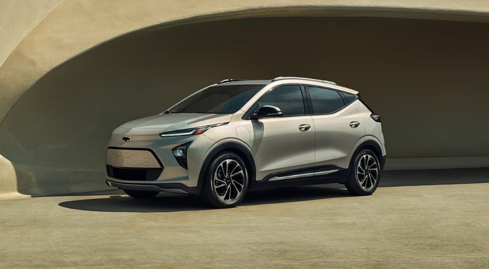 A tan 2022 Chevy Bolt EUV is shown in an alcove.
