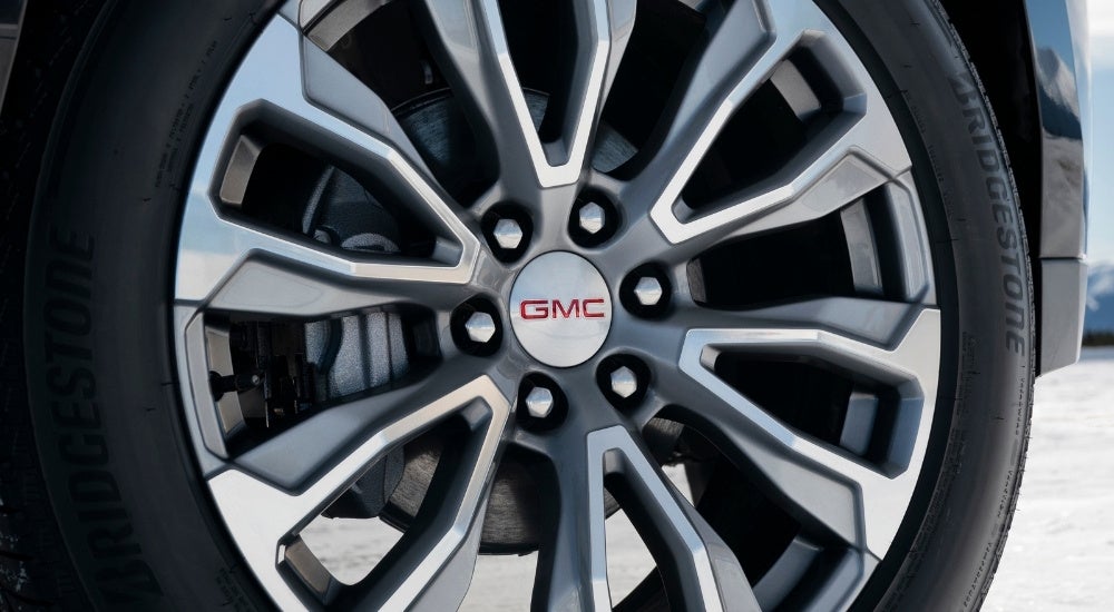 A close up shows a silver wheel on a 2021 GMC Yukon Denali after the owner wen to sell their car.