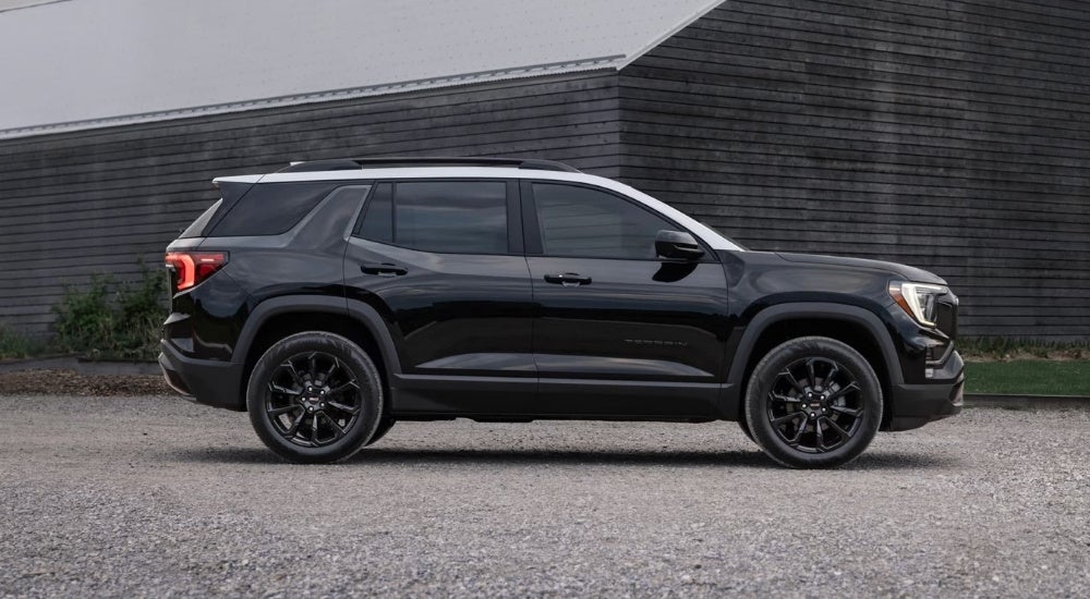 A black GMC Terrain for sale near Corinth parked near a barn
