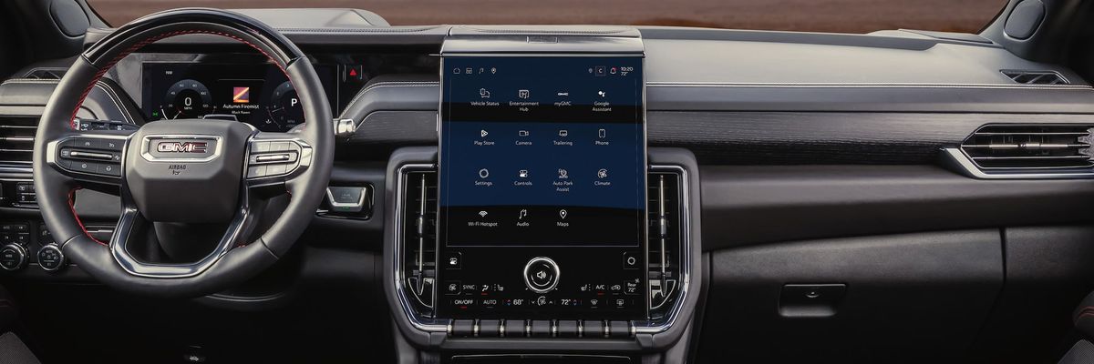 2026 GMC Yukon AT4 Ultimate interior showing steering wheel, digital instrument cluster, and center touchscreen