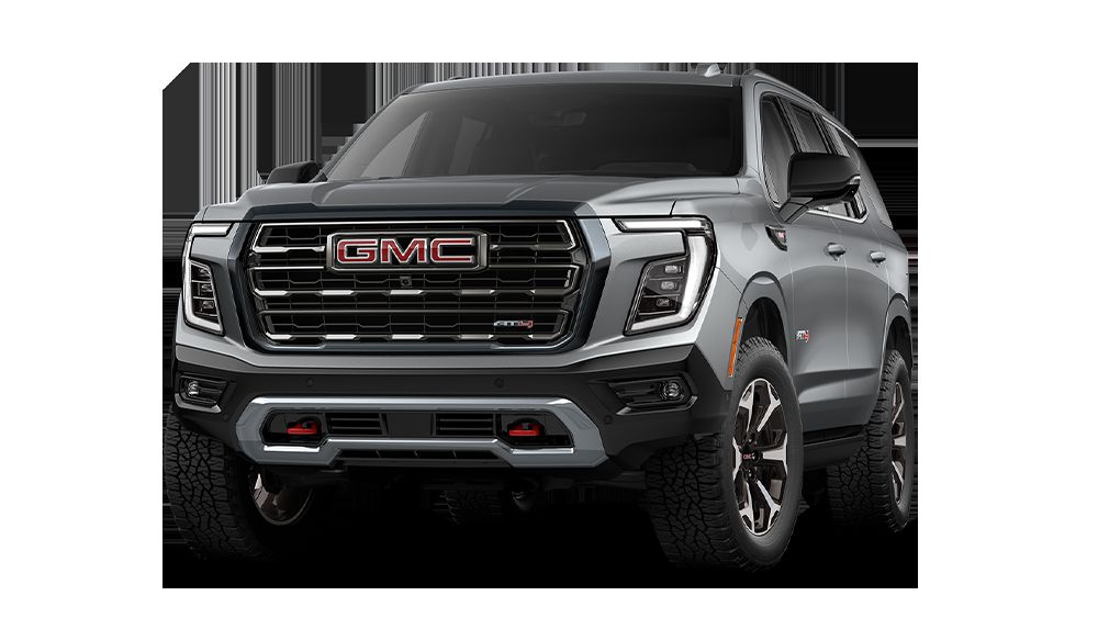 2026 GMC Yukon AT4 Ultimate in Sterling Metallic, three-quarter front view with off-road wheels