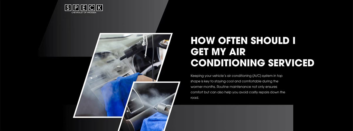 Chevrolet service technician servicing car air conditioning system with blue towel and refrigerant