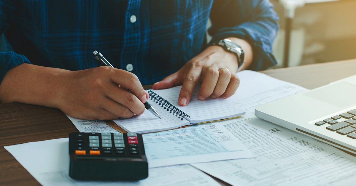 Person filling out financing paperwork