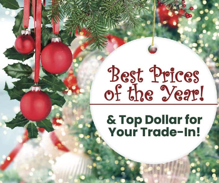 Christmas ornament advertising "Best Prices of the Year" sale with red baubles and festive holiday background