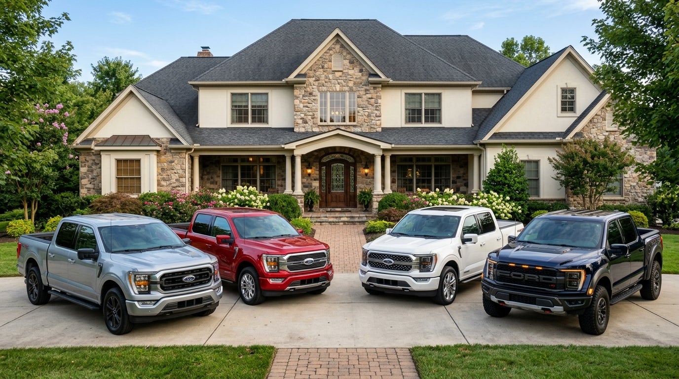 {
 "altText": "Four different colored Ford F-150 pickup trucks parked in a paved driveway in front of a large luxury house." (Representative image for illustration purposes only. Actual vehicle may vary based on trim and configuration.)