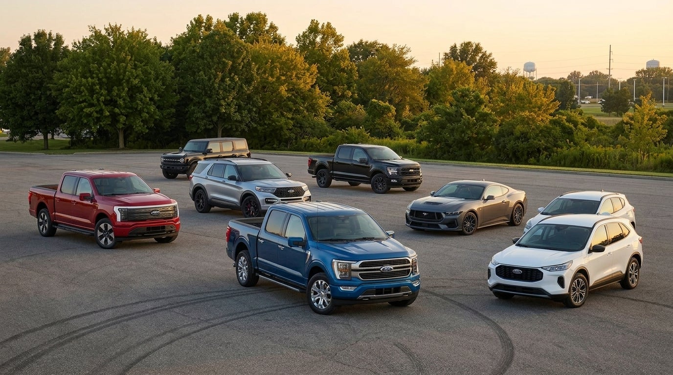 A lineup of Ford vehicles including F-150 trucks, a Mustang, Bronco, and SUVs parked on an asphalt lot. (Representative image for illustration purposes only. Actual vehicle may vary based on trim and configuration.)
