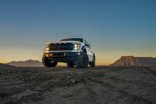 White Ford F-150 driving up