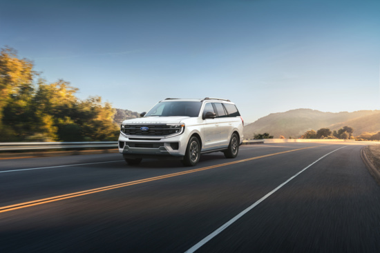 Dark SUV, likely a Ford Expedition