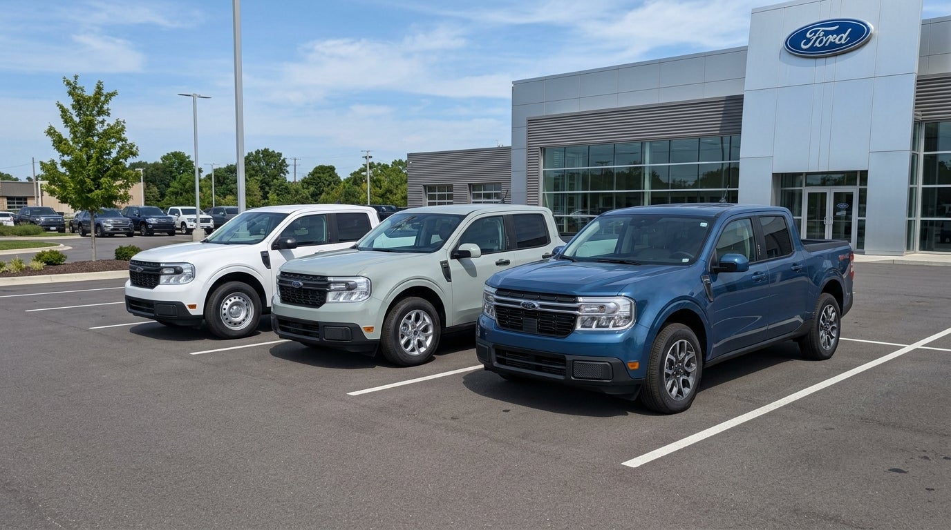 Three Ford Maverick pickup trucks in different trims parked outside a Ford dealership. (Representative image for illustration purposes only. Actual vehicle may vary based on trim and configuration.)