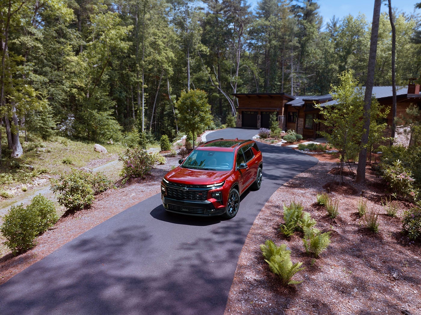Chevy Traverse parked on a paved driveway.