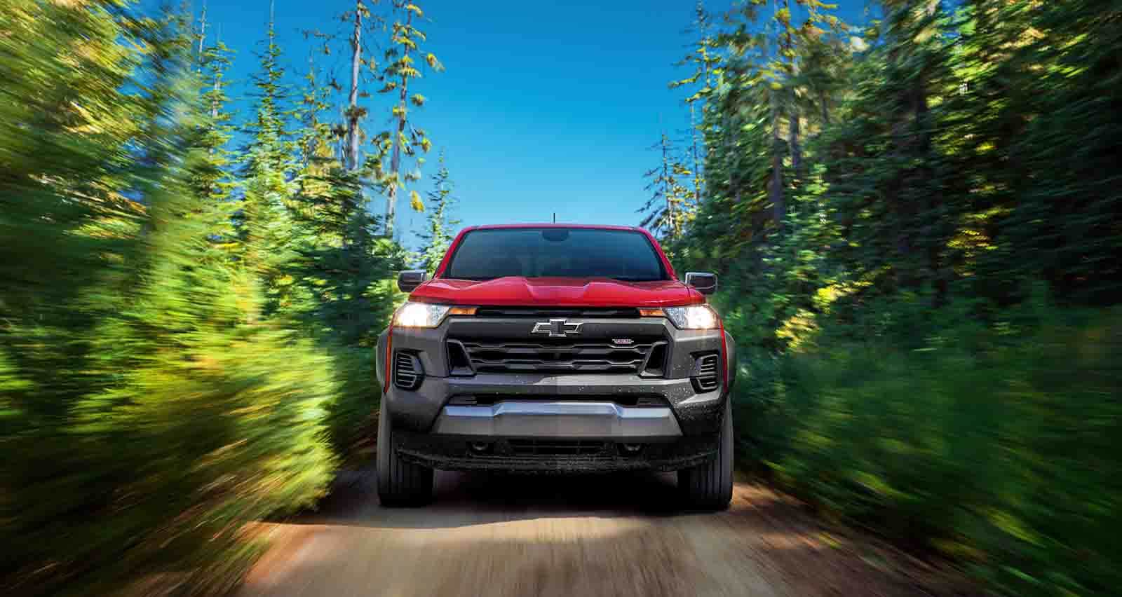 Chevy Colorado driving on dirt road.