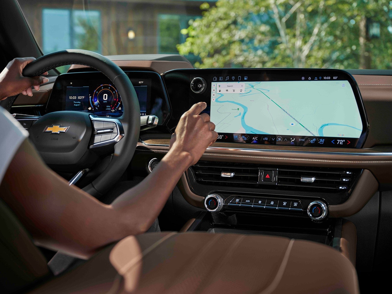 woman using car's touchscreen navigation system inside a vehicle.