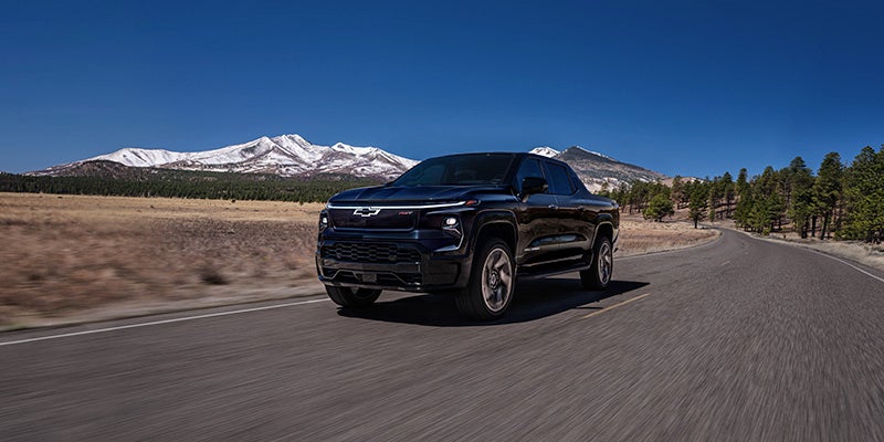 Silverado EV driving on a mountain road.