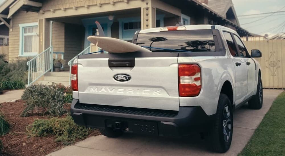 A white 2026 Ford Maverick parked on a driveway.