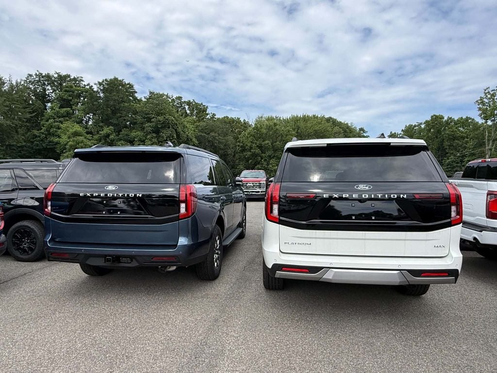 2027 Ford Expedition and Expedition MAX parked side by side, rear view
