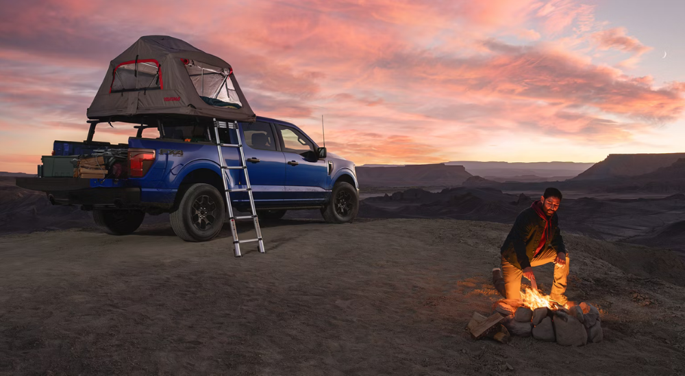 Blue 2026 Ford F-150 Fx4 Off Road parked on a mountain.