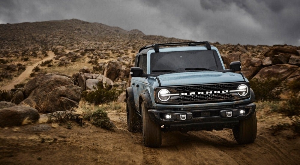 A blue 2025 Ford Bronco for sale near Poughkeepsie from the front at an angle.