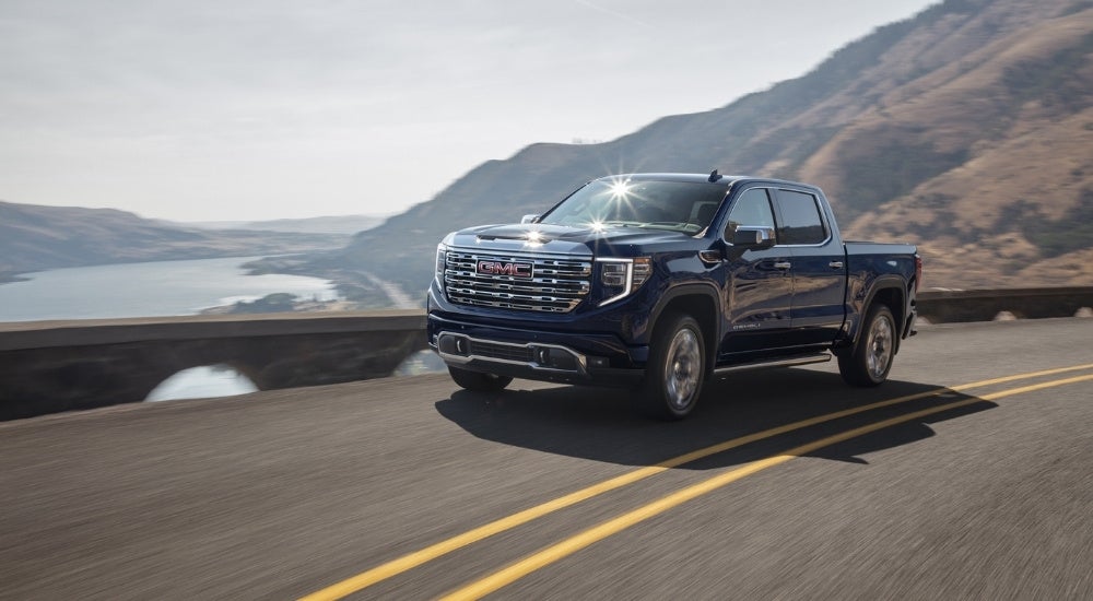 Black 2025 GMC Sierra 1500 driving to a GMC dealer near Clinton Township