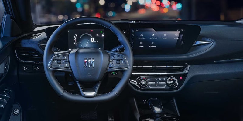 2026 Buick Envista interior with digital display, steering wheel, and widescreen infotainment at Stadium Buick GMC in Salem, OH.
