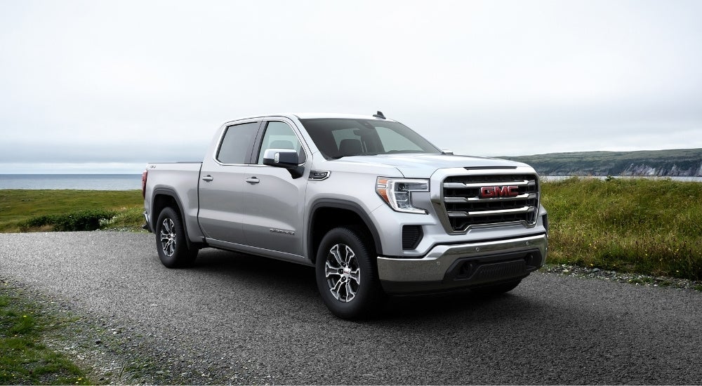 Silver 2021 GMC Sierra 1500 parked near a lake