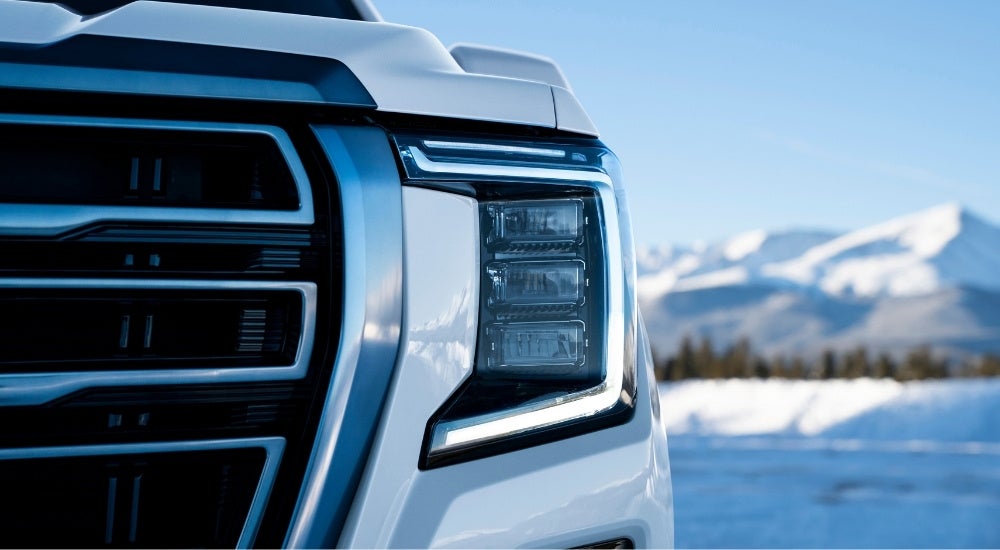 Headlight on a white 2021 GMC Yukon AT4