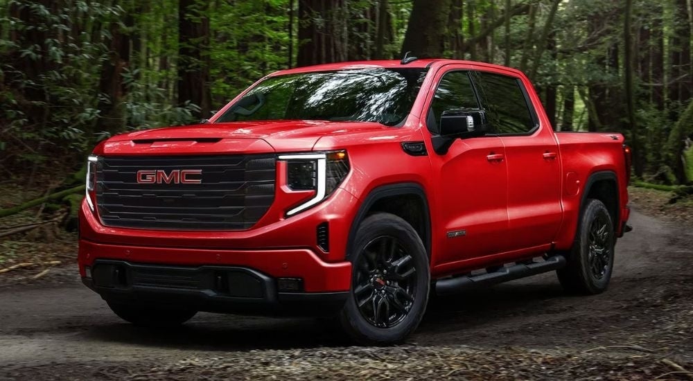 Red 2025 GMC Sierra 1500 Elevation is rounding a corner