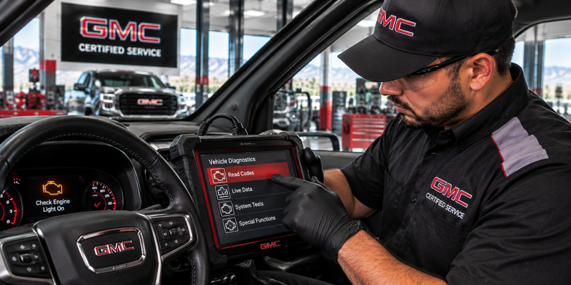 GMC check engine light diagnostics in a service bay