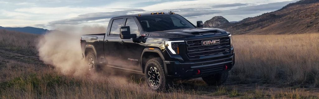 2026 GMC Sierra 2500 off-road truck equipped for rugged terrain, highlighting power and performance at Country Club GMC in Oneonta, NY.