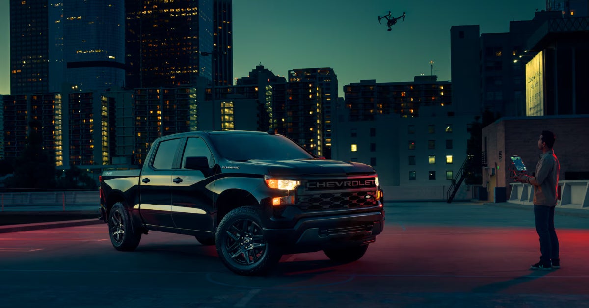 2025 Chevy Silverado 1500 parked at an empty space at night