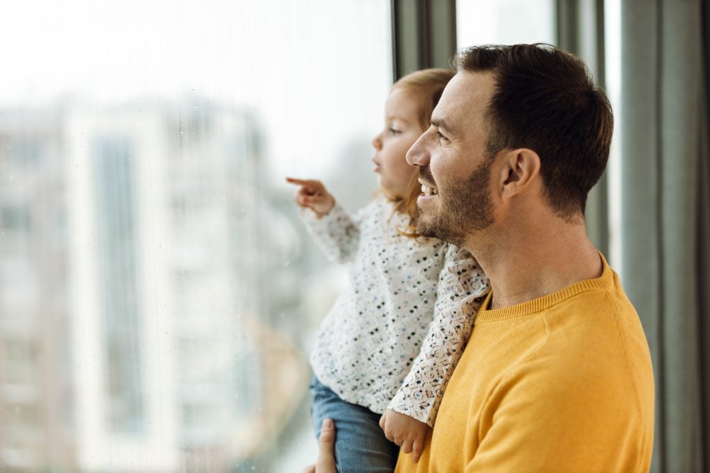 Father holding his child.
