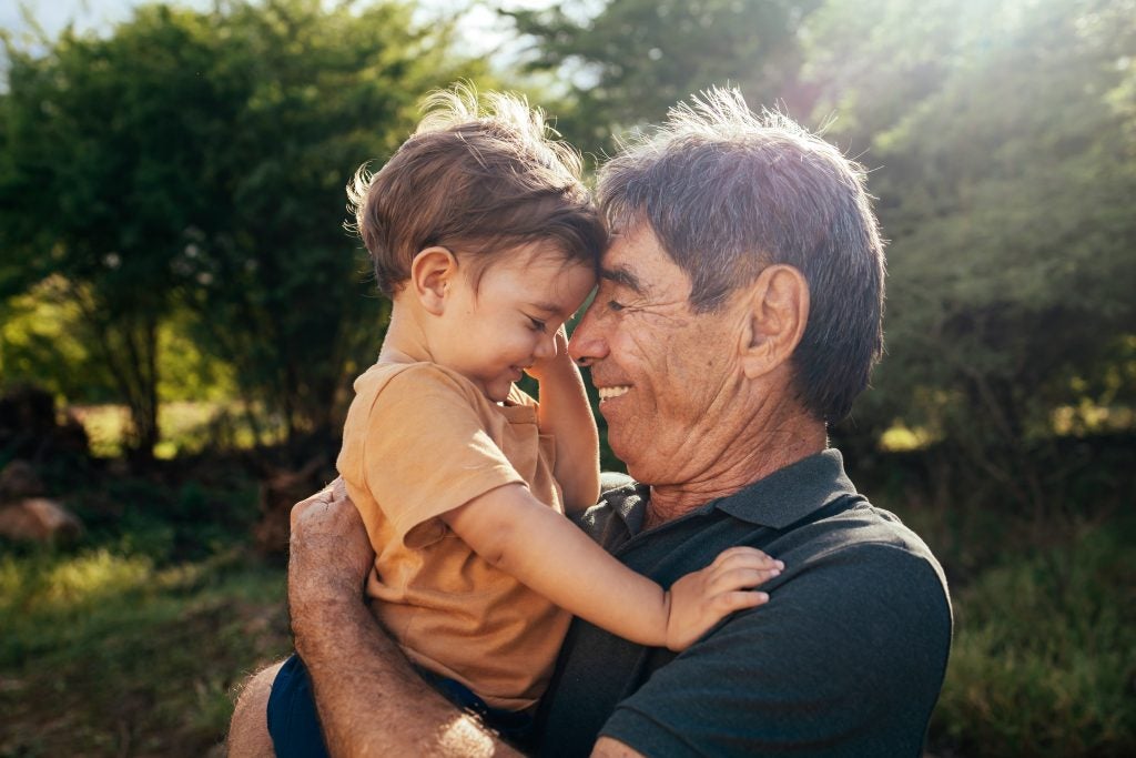 Dad holding his child.