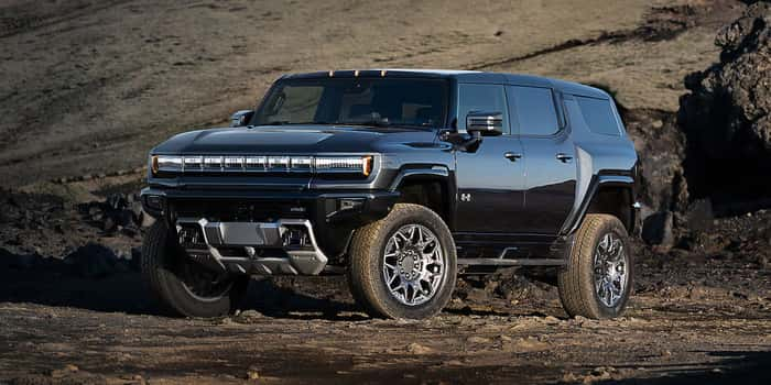 Black GMC Hummer EV parked in the dirt