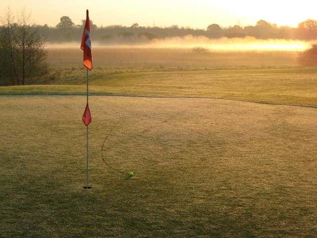 Photo of a red flag on the golf course