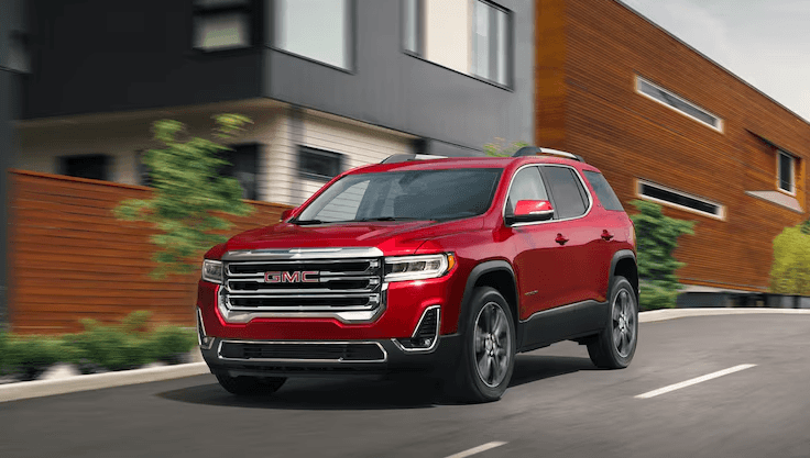 Used GMC Vehicle driving on road