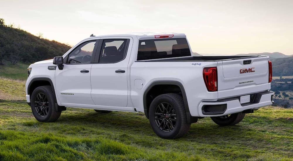 A white 2024 GMC Sierra 1500 is shown parked off-road after visiting a GMC dealer near Humboldt.