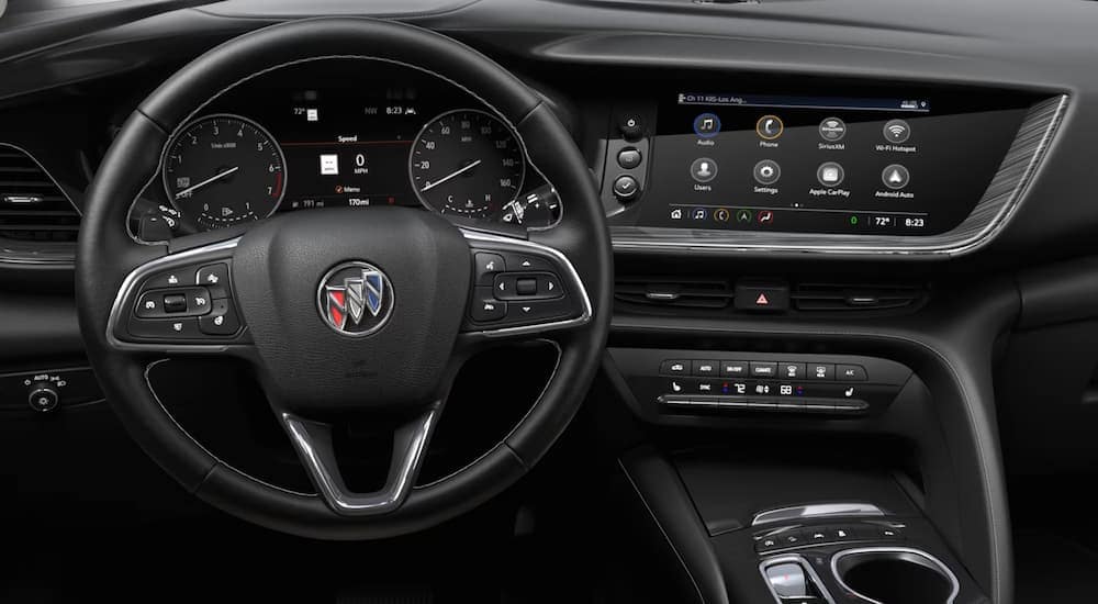 The black interior and dashboard in a 2023 Buick Envision ST at a Buick dealer near Manson.
