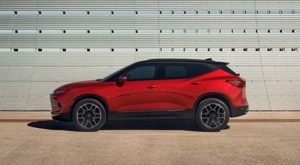 A red 2024 Chevy Blazer is shown parked at a Chevy dealer near Rockwell City.