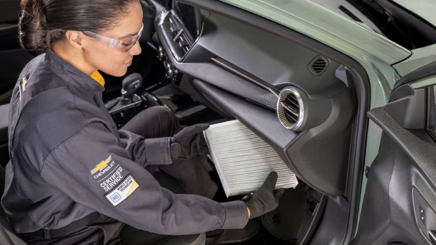 Changing the Chevrolet air filter.