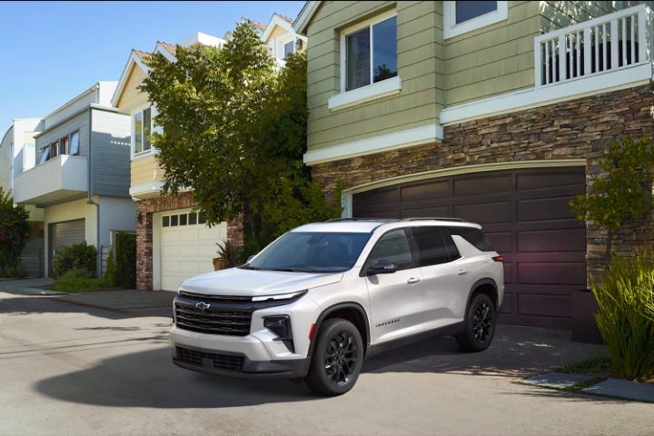 Chevy Traverse parked in a driveway at home.