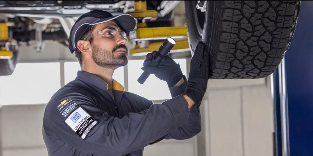 Service technician-checking tires and brakes.
