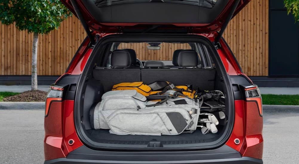 Rear cargo area in a red 2026 Chevy Equinox.