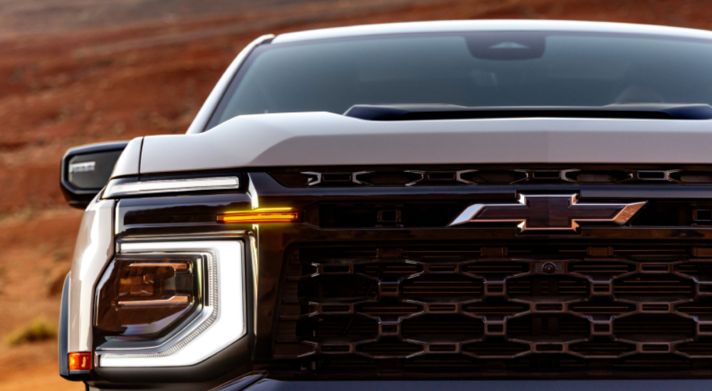 Headlight of a tan 2027 Chevy Silverado 1500