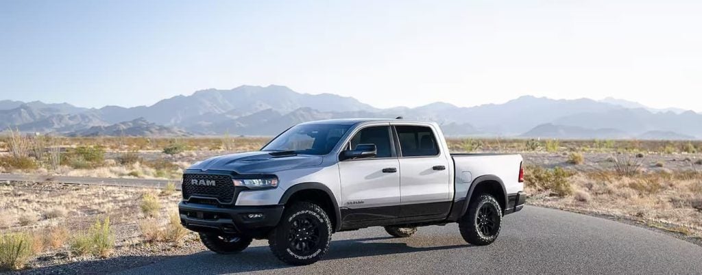 A silver 2025 Ram 1500 parked on a sunny day.