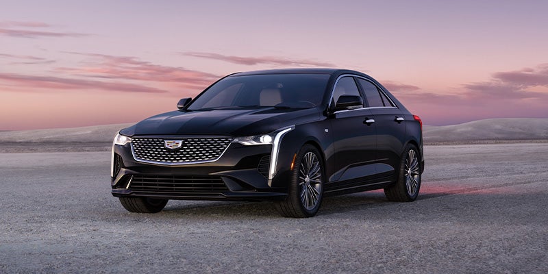 Cadillac CT4 parked in desert like background.