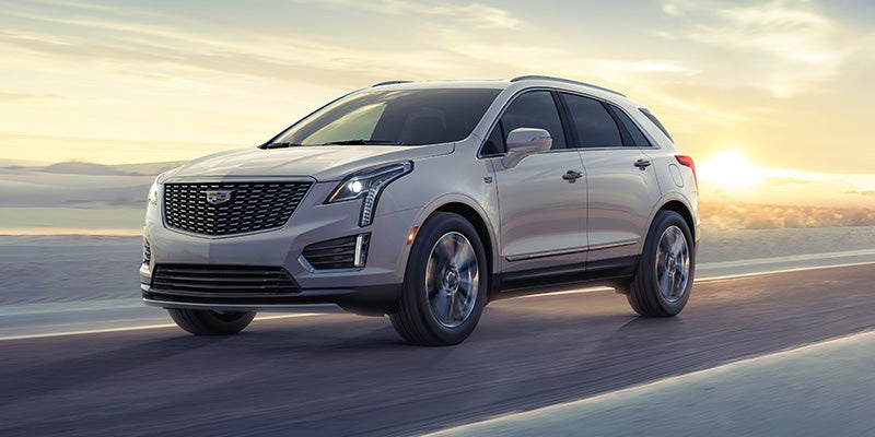 Cadillac XT5 driving on road.